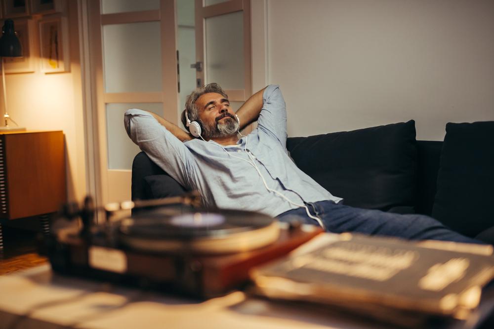 A man relaxing while listening to music.